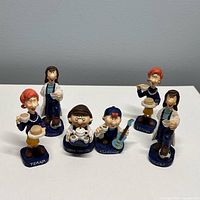 Front view of all six Tetley Tea Folk figurines