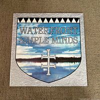 Front picture sleeve with Waterfront Simple Minds title