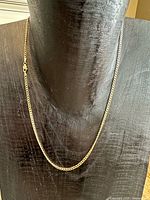 Necklace displayed on bust showing full length and link style