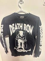 Front view of black crewneck showing Death Row graphic and sleeve prints