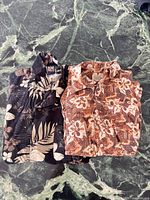 Two shirts folded showing patterns