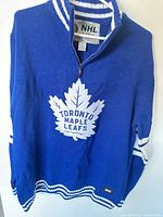 Front view showing logo, zipper and collar detail