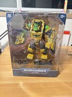 Front view of sealed McFarlane Toys Warhammer 40,000 Ork Meganob action figure in box