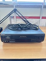 Front view of Sony SLV-N50 VCR with coaxial cable placed on top