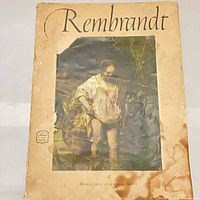 Front cover showing title, artwork image, staining and wear