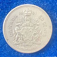 Reverse showing Canadian coat of arms, denomination and date