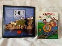 Front view of 2004 Oh! Canada set box and 2006 Canada Day coin folder