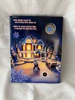 Front of sealed presentation folder showing coin inset and winter artwork