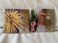 Front covers of 2007 and 2008 commemorative coin folders