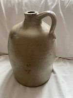 Full view of stoneware jug showing handle, body and mouth
