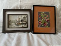 Both framed watercolors side by side