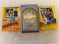 front view of three baseball card boxes: 1992 O-Pee-Chee Premier, 1992 Leaf Set, 1989 Donruss