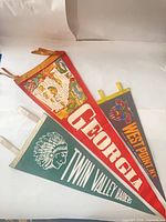 All three overlapping felt pennants showing graphics and lettering