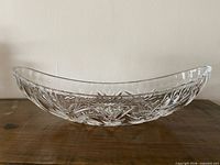 Side view of clear pinwheel cut crystal banana dish