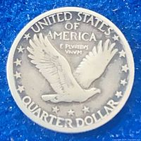 Reverse of Standing Liberty quarter showing flying eagle and legends