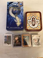 Front view showing Michael W. Kaluta box, Hershey’s tin, four sleeved cards