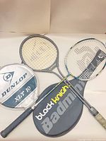 Two racquets with respective covers displayed