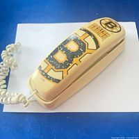 Top view of closed Bruins telephone showing team graphics