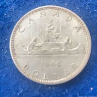 Reverse side showing CANADA, voyageurs canoe design, date 1966