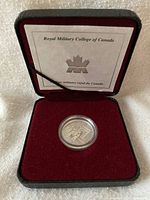 Coin in open clamshell case with RMC card visible