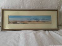 Full view of framed panoramic landscape print with mat and frame