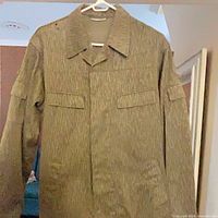 Front view of Strichtarn field jacket on hanger