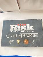 Front of Game of Thrones Risk box showing logo and sigils
