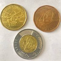 Group shot of three Canadian commemorative coins
