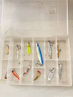 Overall view of Plano box with 11 lures inside compartments