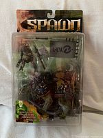 Front of sealed blister pack showing figures and accessories