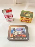 Front view of the three tins