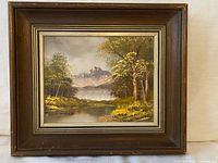Full view of framed oil on board landscape painting