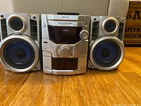 Front view of Panasonic SA-AK110 main unit with both speakers