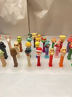 Full group of character PEZ dispensers front and back rows