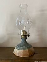 Full view of pottery oil lamp assembled