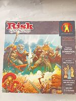 Box lid showing title, artwork, player count, and component count