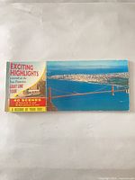 Front cover of postcard booklet showing title and Golden Gate Bridge