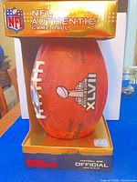 Football in gold Wilson NFL Authentic Game Ball box