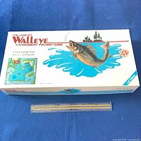 Top view of game box showing title, artwork and scale reference