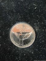 Obverse of silver-plated medallion showing design and inscriptions