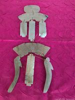 Full view of seven-piece jade hanging ornament on pink background