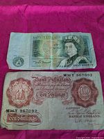 Obverse of both banknotes showing denominations, serial numbers and overall wear