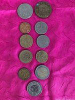 All ten coins laid out, obverse visible