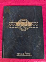 Front cover of blue Mail Poste stamp album