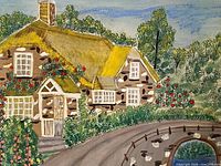 Close view of cottage, garden and thatched roof detail