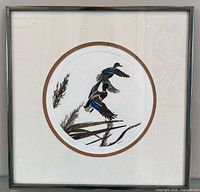 Framed circular-matted print showing ducks in flight