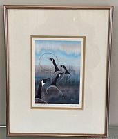 Full view of framed signed print in rose gold frame