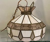 Full view of stained glass chandelier showing overall shape and colors