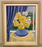 Front view of framed still life painting