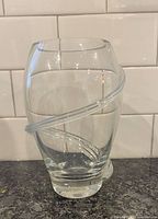 Front view of clear crystal vase with applied ribbon swirl